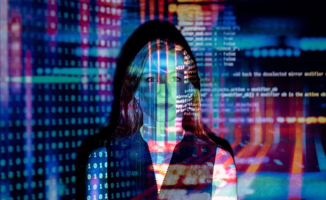 woman behind computer screen