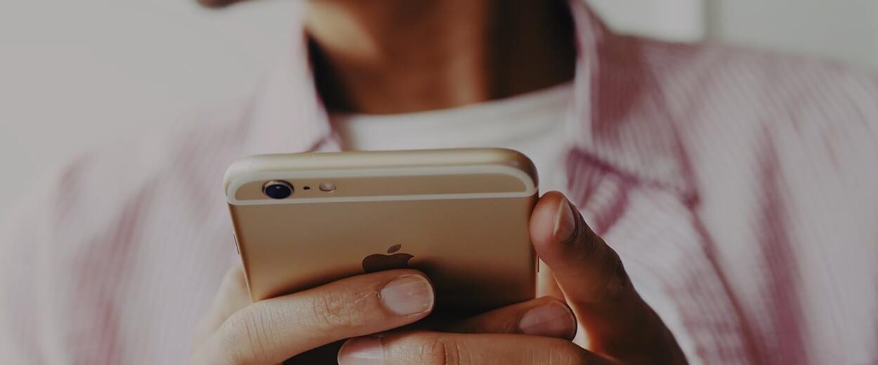 Woman using iphone.