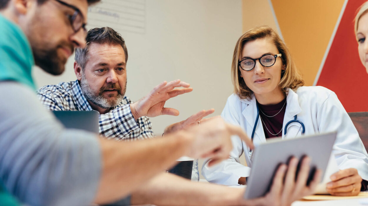 group of doctors discussing on reports tseeing on a digital screen