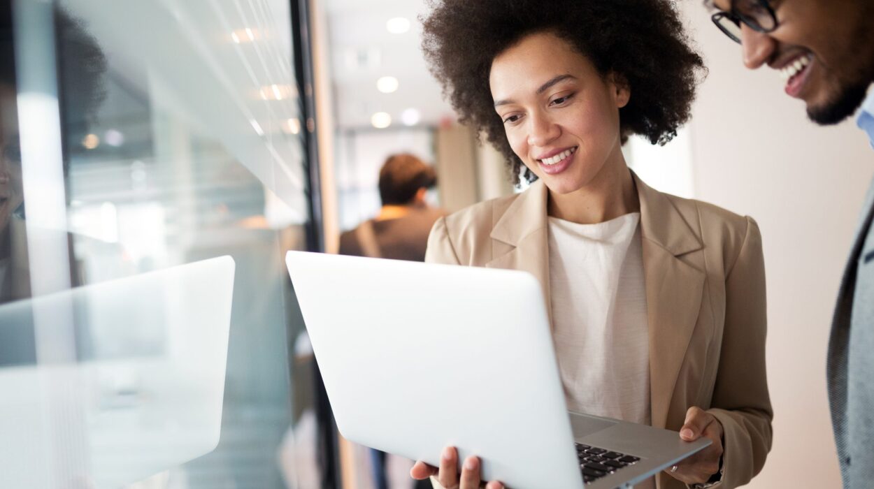A woman and man looking at the laptop and analyzing use of NLP in automated resolution of tasks